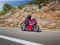 Honda CBR500R auf einer Straße, fahrend, vor einer mediterranen Kulisse,