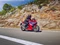 Honda CBR500R auf einer Straße, fahrend, vor einer mediterranen Kulisse,