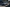 Weißer Hyundai TUCSON fährt auf einer städtische Autobahn.