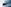 Opel Corsa parkend vor einer grauen Wand, frontal seitlich.