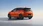 Oranger Kleinwagen BYD von schräg hinten