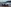 Geparkter Honda SUV mit Seepanorama im Hintergrund.